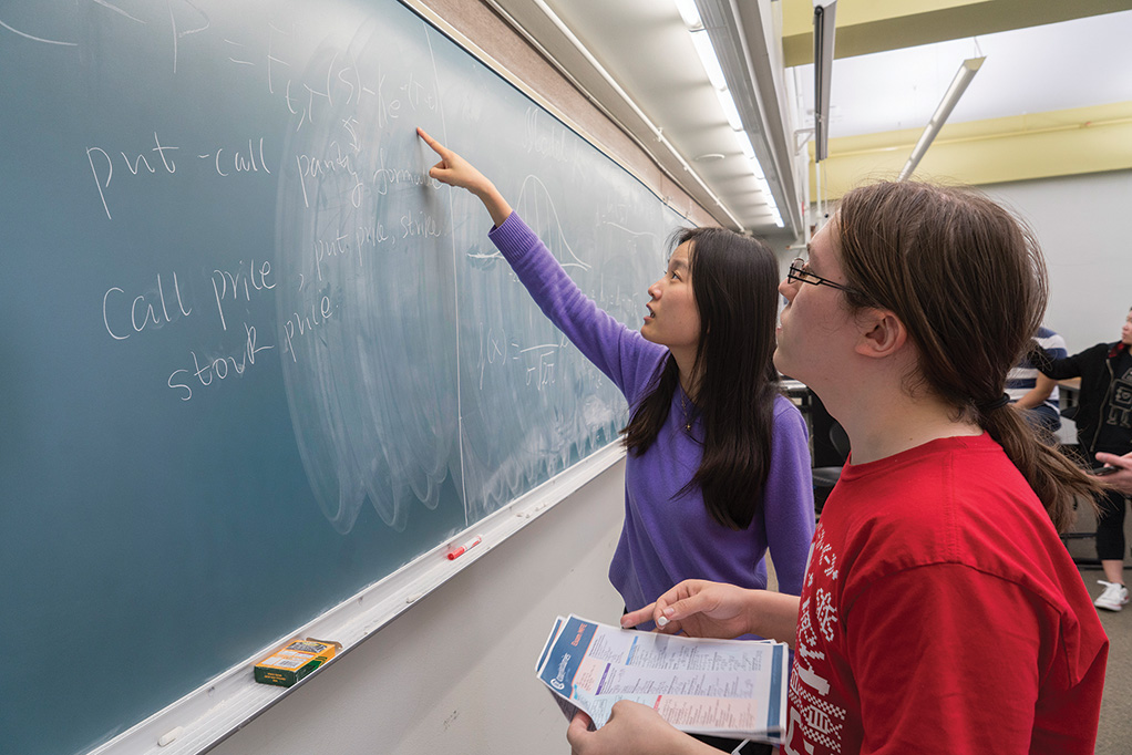 left to right: Professor Huang working with senior Nathan Gregory. 