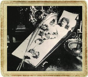 Actress Sarah Bernhardt posing in her traveling coffin.