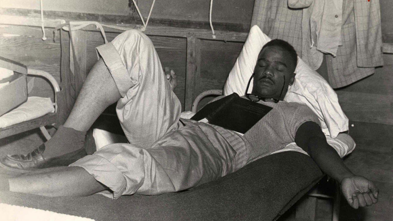 Harold Washington takes a nap at Roosevelt University summer camp in the 1940s.