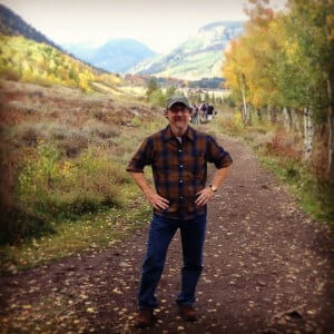 Professor Michael Bryson, PhD on a hike through an aspen forest outside of Crested Butte CO