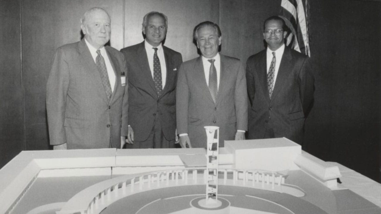 Ted Gross and an architectual model of the Schaumburg Campus